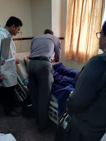 UK surgeon Ahmed Mustafa and breast nurse specialist Michelle Johnson visit patients who were underwent breast surgery the previous day, during the post- op ward round at Rafidia Hospital 