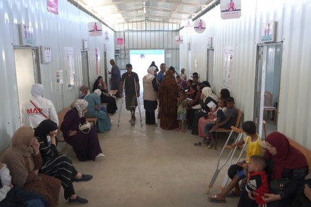 People in the waiting area at MAP's solidarity Polyclinic